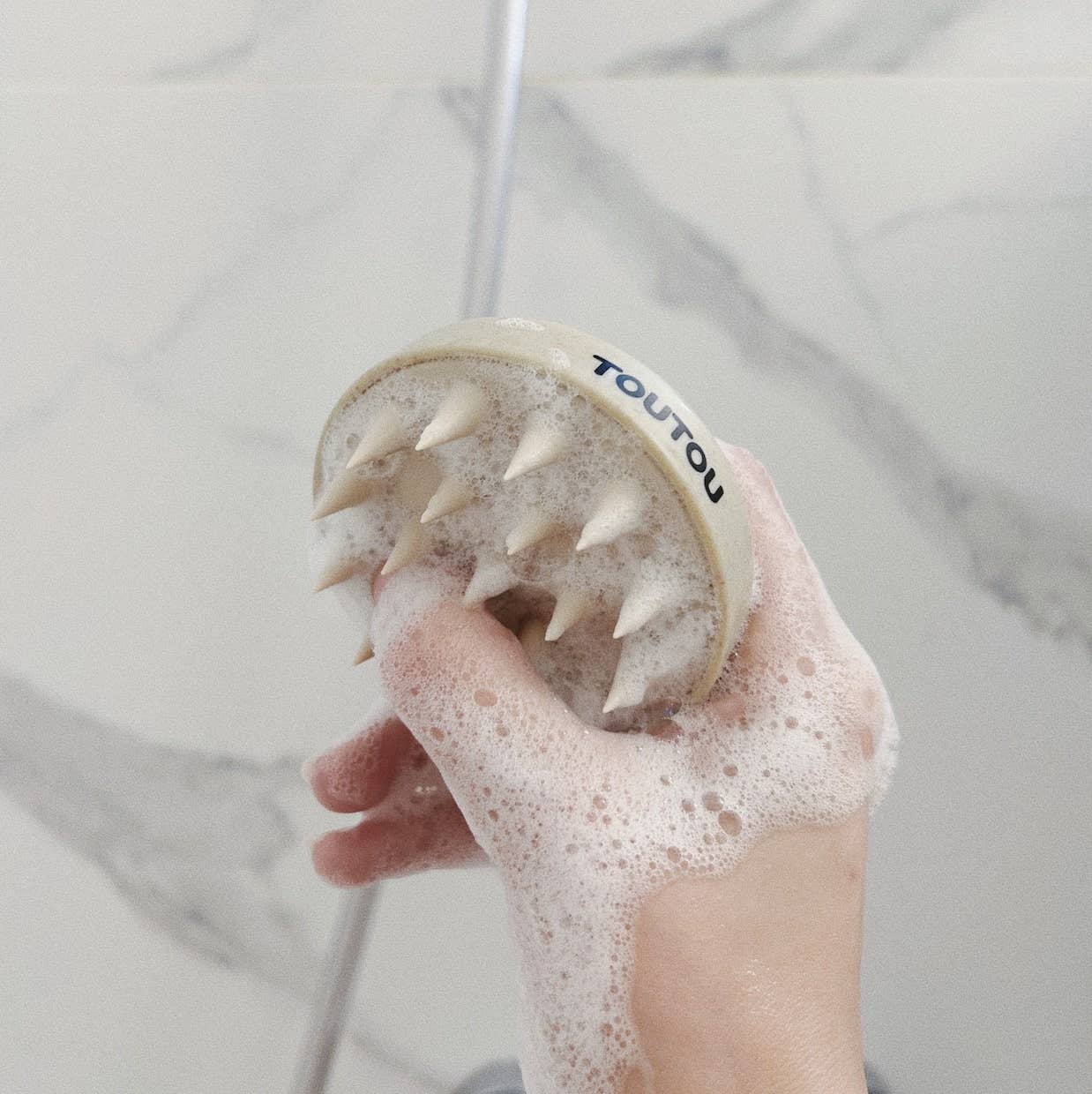 Brosse pour la douche